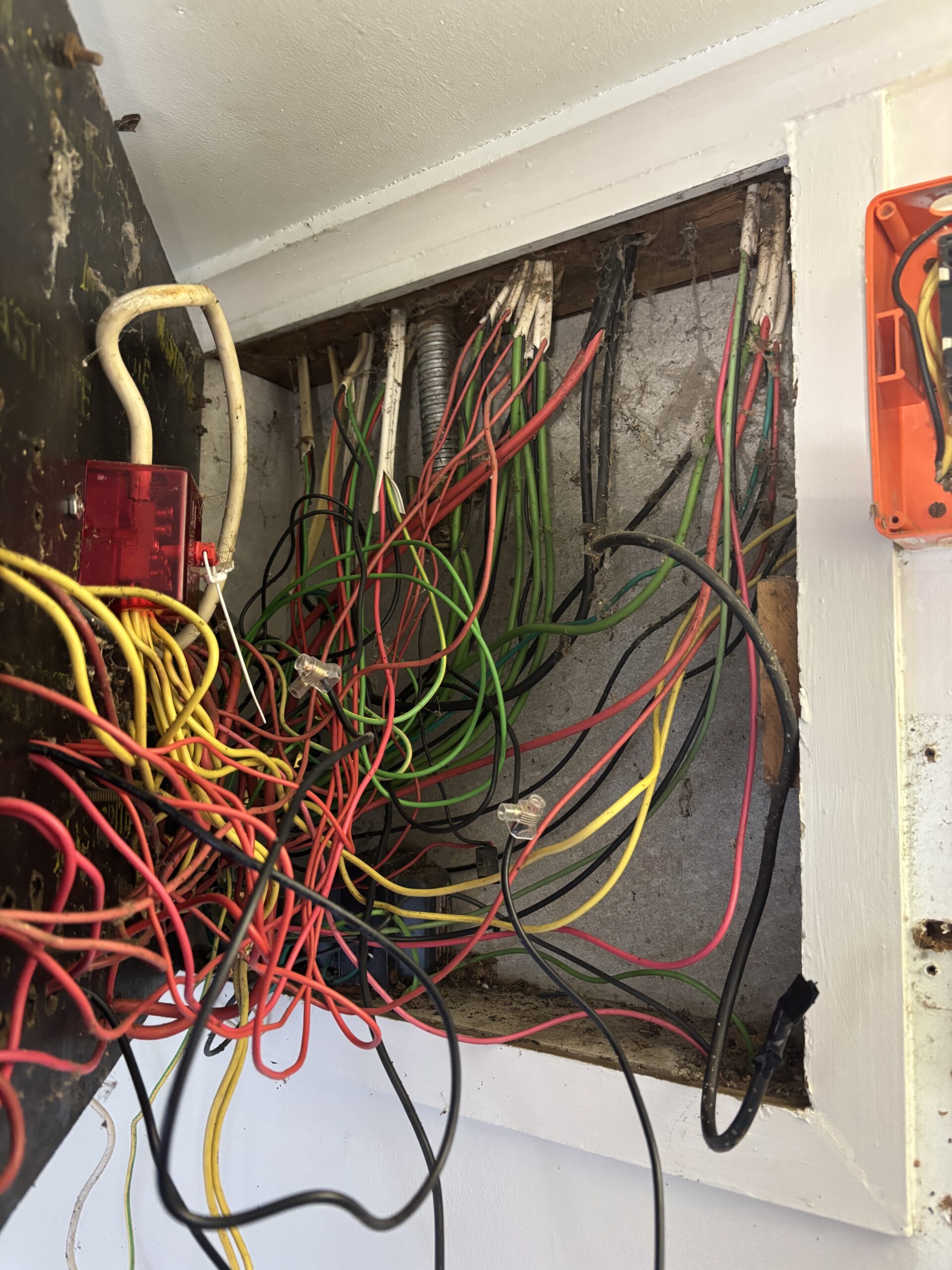 Old wiring behind switchboard before upgrade